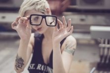 Henna model blond hair short hair pixie cut glasses